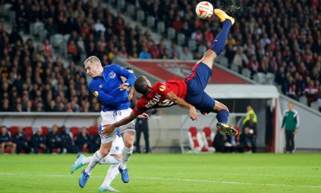 Ronny Rodelin of Lille is challenged by Tony Hibbert of Everton as he attempts a spectacular shot.