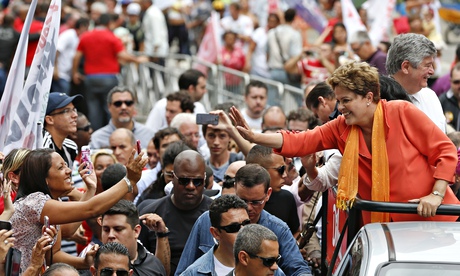 Brazil's president Dilma Rousseff greets a crowd