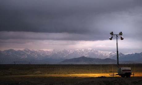 A set of security lights illuminate the landscape at Bagram air base in Afghanistan. 