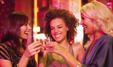 women drinking shots