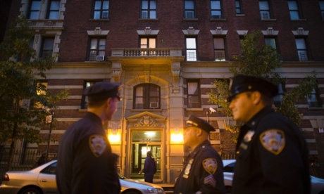 Police officers stand outside the home of Craig Spencer, a Doctors Without Borders physician  diagnosed with Ebola patients.