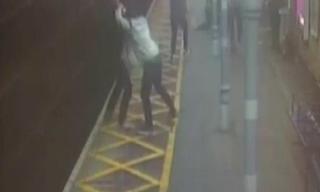 Still taken from CCTV footage of a registered blind man being pushed onto the tracks during a violent assault at a Chelmsford station.