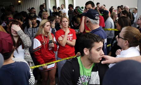 Students wait for family members in a nearby church after the shooting at Marysville-Pilchuck high school.
