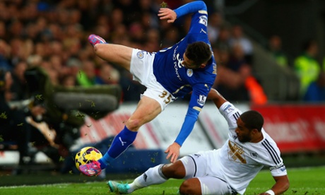 Ashley Williams goes to ground. David Nugent goes to air.