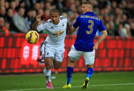 Wayne Routledge tries to skip past Paul Konchesky.