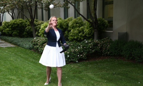 Fiona Scott throws a baseball at a function to launch the 2014 Australian baseball season.
