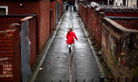 Girl running down alleyway, manchester
