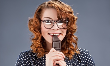 Woman eating chocolate