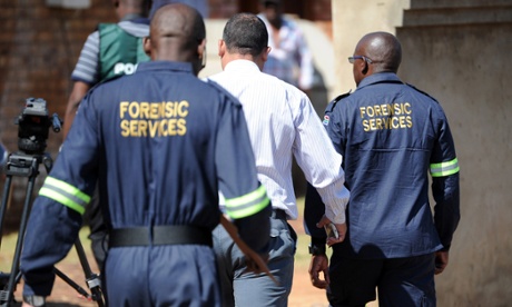 South African forensic investigators enter the home of actress and singer Kelly Khumalo in Vosloorus, east of Johannesburg