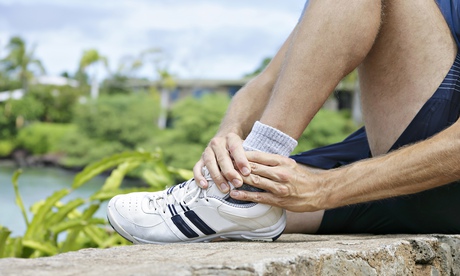 Runner holding his ankle