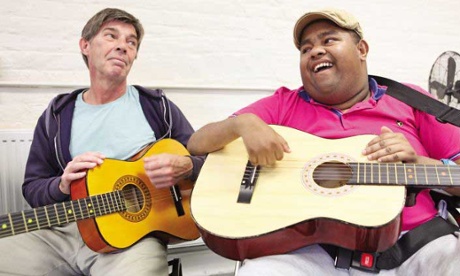 person disabilities learning guitar