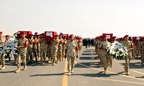 The coffins of 31 Egyptian soldiers killed in the Sinai peninsula o