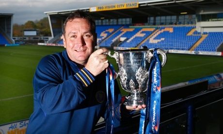 It's Shrewsbury Town boss Micky Mellon. And he's already got his paws all over the Capital One Cup!