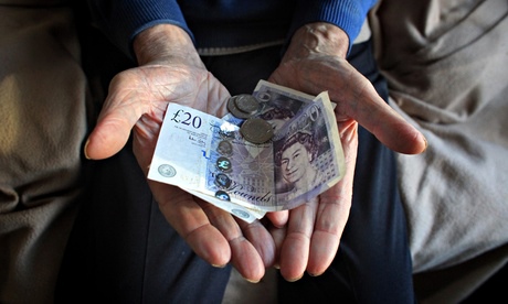 Elderly man holds cash 