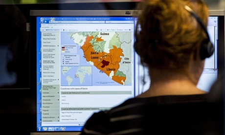 A woman looks at a map at the Dutch National Institute for Public Health and the Environment (RIVM) nationwide telephone information center in The Hague on October 20, 2014 set up for people who have questions about the virus of Ebola.