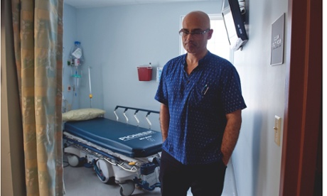 Richard Kaul in a hospital room