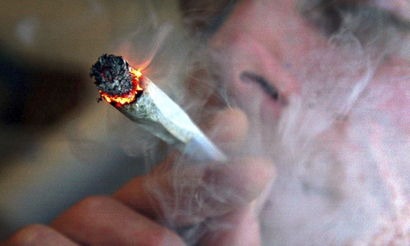 A file photo of an unidentified man smoking cannabis