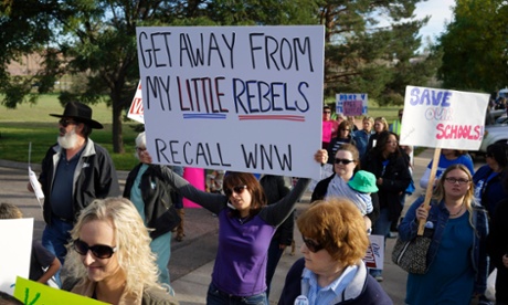 Protesters against proposed changes to the national history curriculum march outside the Jefferson County school board meeting.