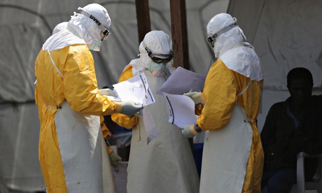 Health workers at the Elwa 3 Ebola treatment center in Paynesville, Liberia