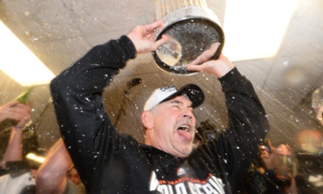 Confidence man: San Francisco Giants manager Bruce Bochy lifts the World Series trophy.