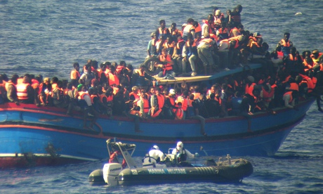 A crowded boat of immigrants during a rescue operations off the coast of Sicily