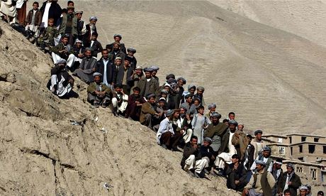 People gather near the gold mine site in Nor Aaba in Takhar province.