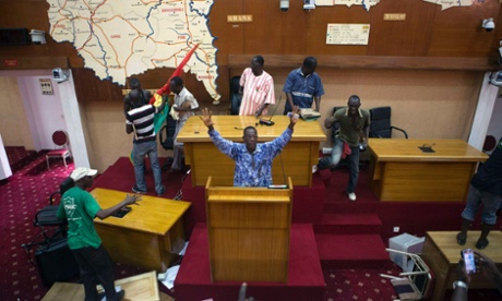 Anti-government protesters take over the parliament building in Ouagadougou, capital of Burkina Faso, October 30, 2014.