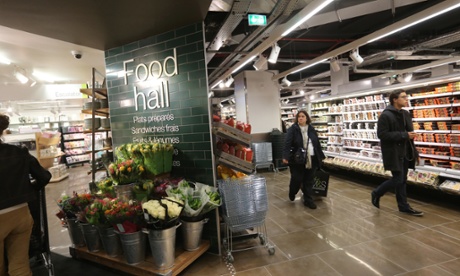 Customers do some shopping in a Marks & Spencer store on its opening day on October 18, 2012 at the So Ouest shopping center in Levallois-Perret, outside Paris.