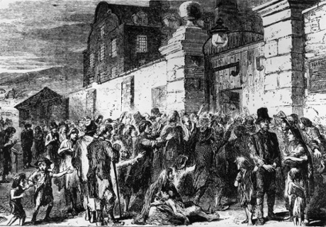 Starving peasants clamour at the gates of a workhouse during the Irish potato famine.
