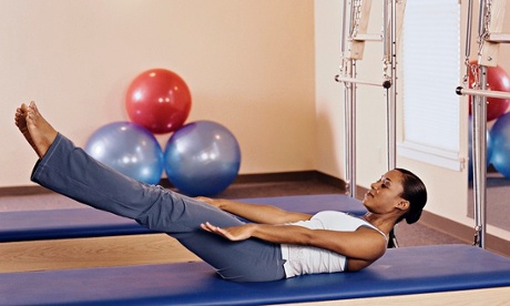 Woman practicing pilates