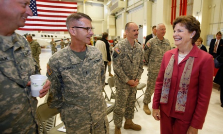 Sen. Jeanne Shaheen, D-N.H., meets with New Hampshire Army National Guard members during a deployment ceremony for troops of Operational Support Airlift  Detachment 18 Wednesday,  Oct. 29, 2014 in Concord, N.H.