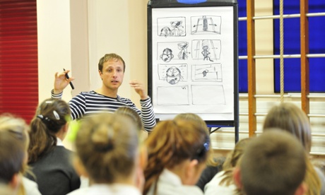 Teacher explaining film storyboard to class