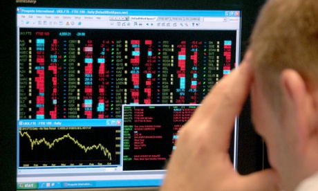 An office worker watches the FTSE 100 index. A senior banker from a leading British bank has pleaded guilty to trying to rig the interbank lending rate Libor.