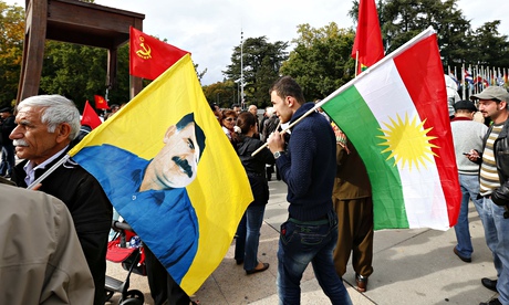 Demonstrators hold flags outside the United Nations European headquarters in Geneva
