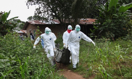 Liberian nurses carry the body of an Ebola victim on the way to bury them in the Banjor Community on the outskirts of Monrovia, Liberia, 06 August 2014. 