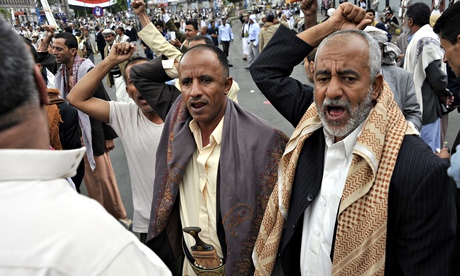 Yemenis shout anti-government slogans after a suicide bomb blast at Tahrir Square in Sana'a