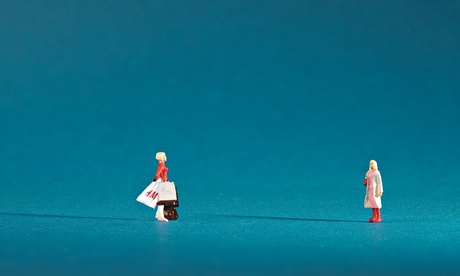 Dolls of a teenager with shopping bags and a mother, standing far apart