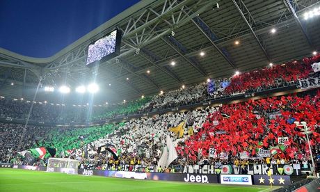 Juventus fans wave flags during a Seria A home match against Atalanta in May 2014