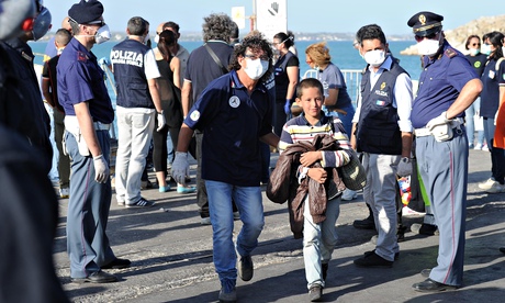 Migrants land at the Sicilian port of Pozzallo