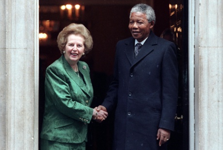 African National Congress leader Nelson Mandela is greeted by British Prime Minister Margaret Thatcher at 10 Downing Street on July 4, 1990 prior to their talks
