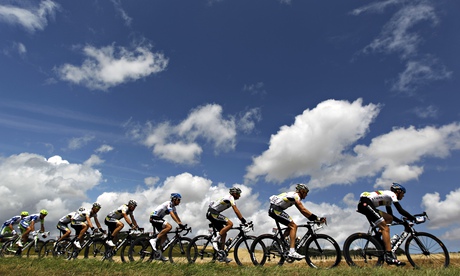 cyclers riding beneath cloudy sky