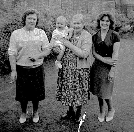 Mary with her family holding Stephen Jarvis as a baby