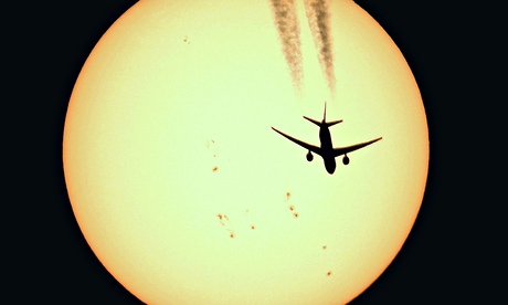 Airline passing in front of sun