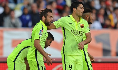 Jordi Alba  celebrates with  Luis Suárez after scoring his team's second goal.