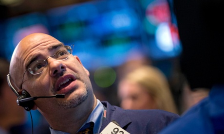 Traders at the New York Stock Exchange as shares hit new highs. Photo: Reuters/Brendan McDermid