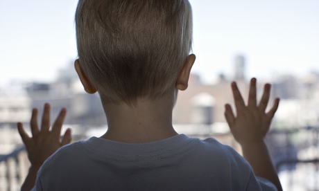 A child looks out a window