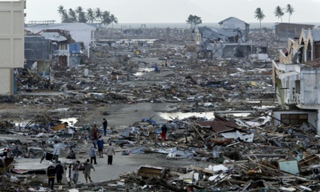 Tsunami survivors search through debris at Banda Aceh, the capital of Aceh province in northwest Indonesia, December 31, 2004
