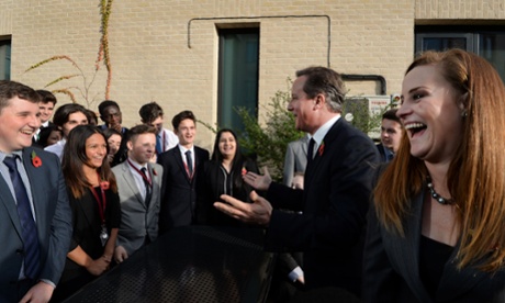 David Cameron speaks with Conservative candidate for Rochester and Strood, Kelly Tolhurst (right), during a visit to Strood Academy earlier today