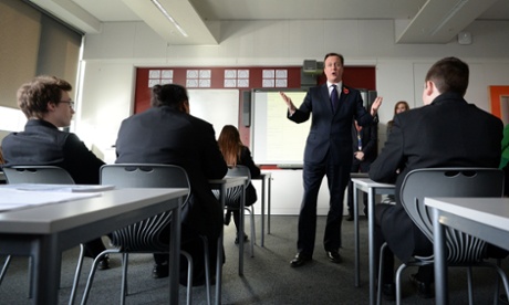 David Cameron helps to teach a politics lesson during a visit to Strood Academy today