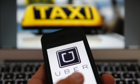 smartphone with uber logo on screen